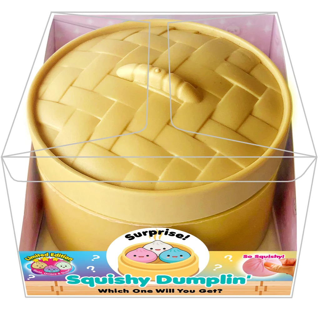 Yellow silicone dumpling mold with a small dumpling inside, packaging visible