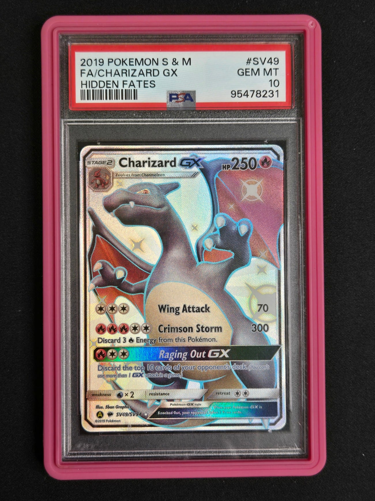 A graded 2019 Pokémon S & M Hidden Fates GX Charizard GX card, PSA graded GEM MT 10, sealed in a pink protective slab against a black background.