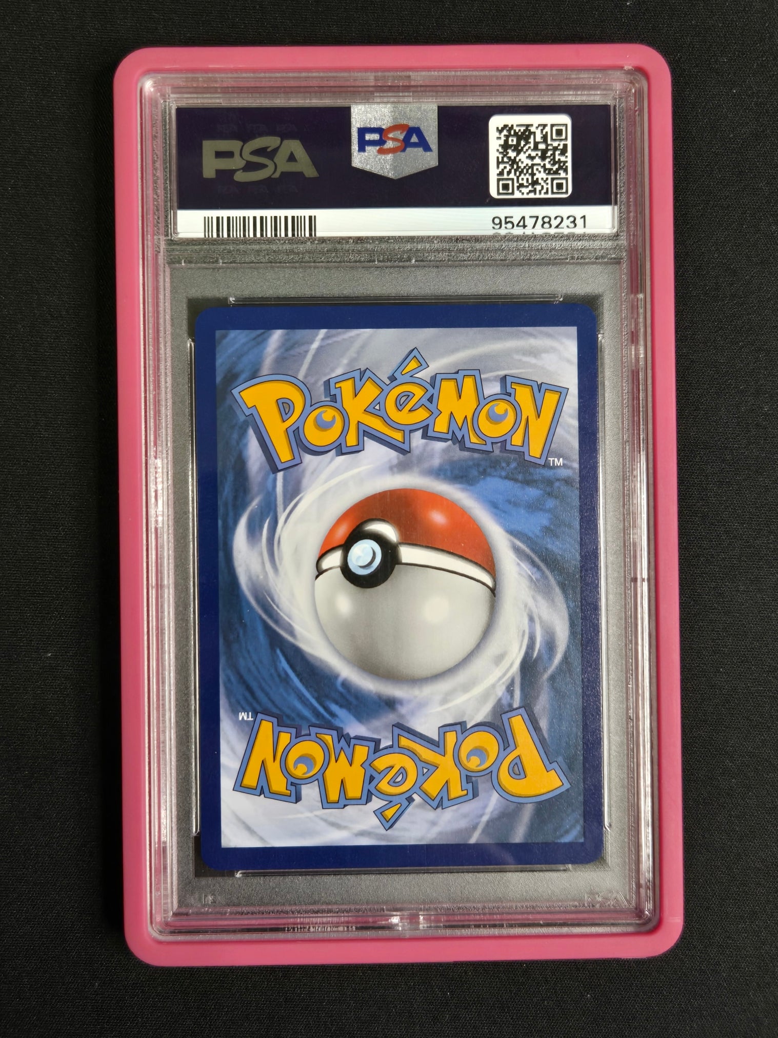 A graded PSA collectible card in a clear plastic slab with a pink border, featuring a Pokémon card with a red and white Pokémon Ball on a blue background.