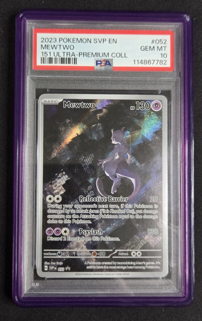 A graded holographic Mewtwo Pokémon card from 2023, encapsulated in a purple PSA holder. The card is graded GEM MT 10 by PSA.