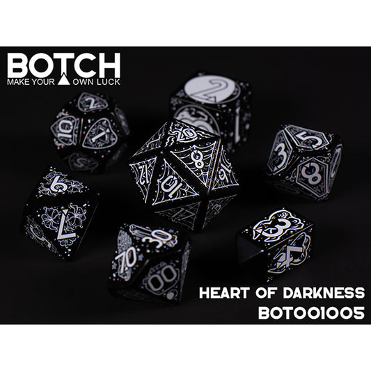 Set of black and white dice with intricate designs on a dark background, featuring the brand 'BOTCH'.
