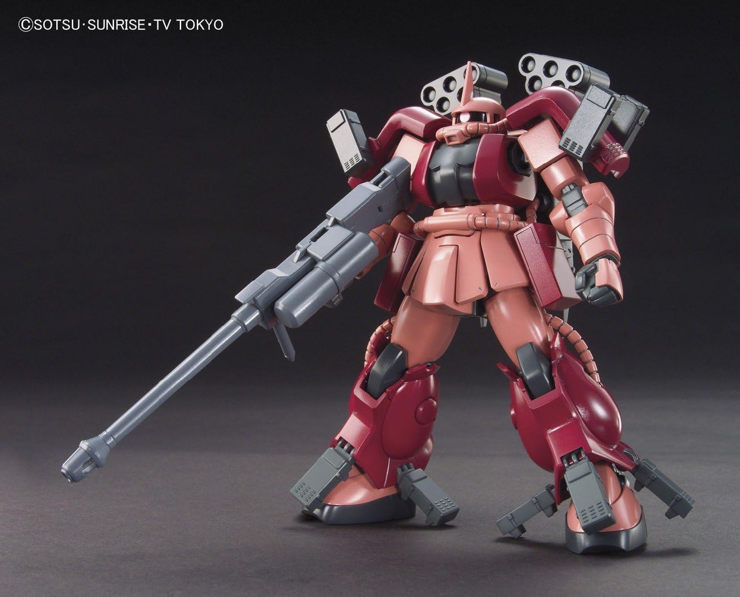 Model kit of a red and black robot with a large weapon on a dark background