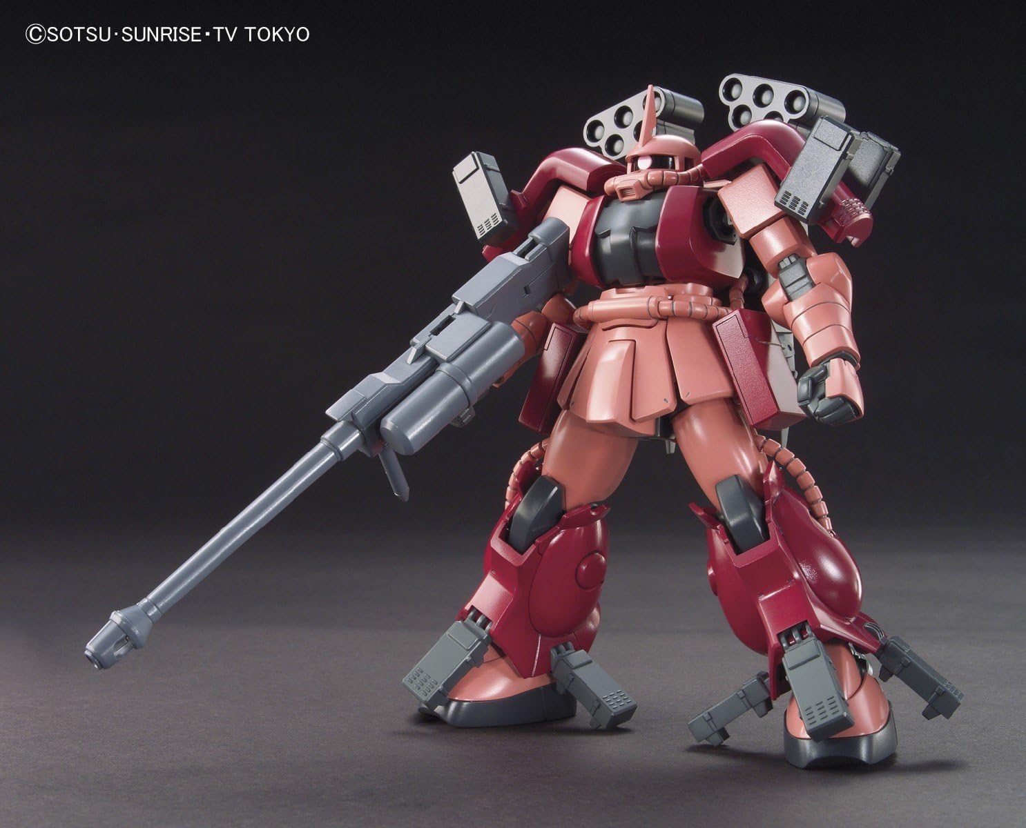 Model kit of a red and black robot with a large weapon on a dark background