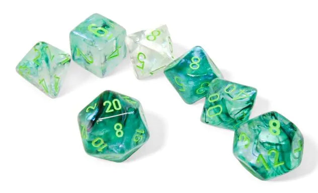 Set of green and clear dice with numbers on a white background
