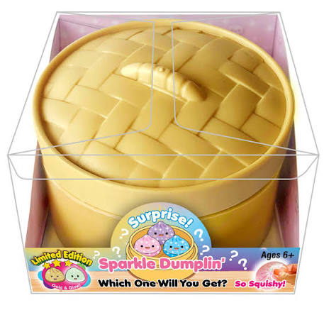Yellow toy resembling a woven basket with a surprise element in its packaging.